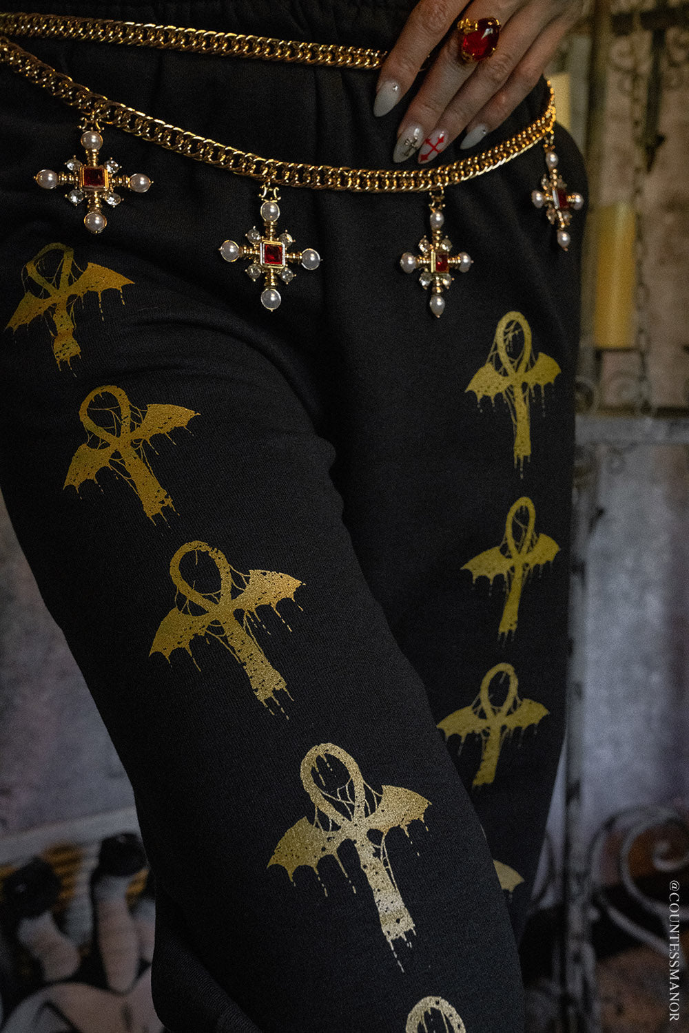 gold metallic ankh symbol jogger pants