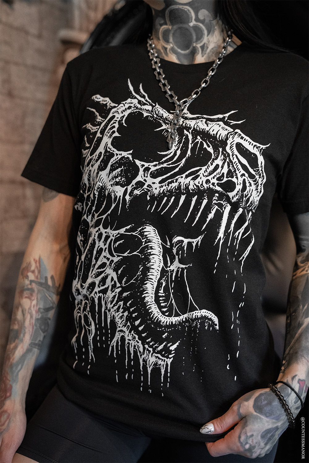 heavy metal t-rex dinosaur fossil bones graphic t- shirt