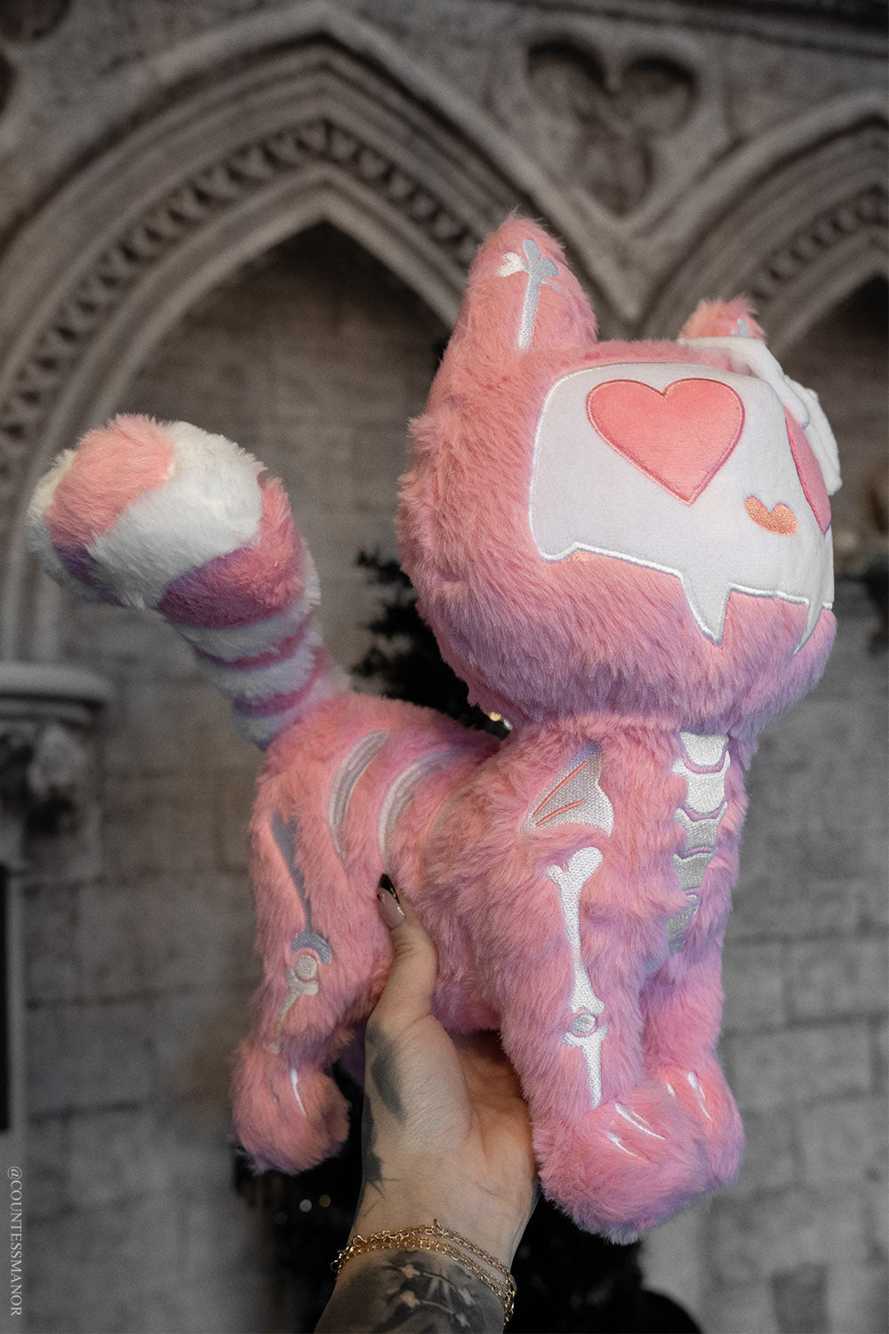 pink and white creepy cute kawaii skeleton cat stuffed animal