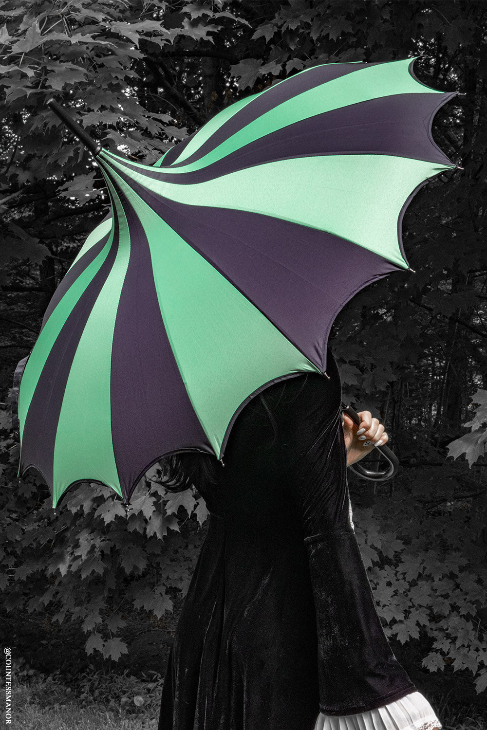striped green and black umbrella with batwing edge