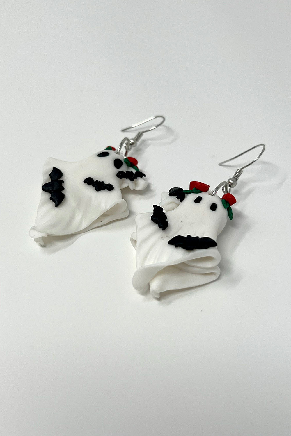 gothic ghosts wearing red rose crowns earrings 