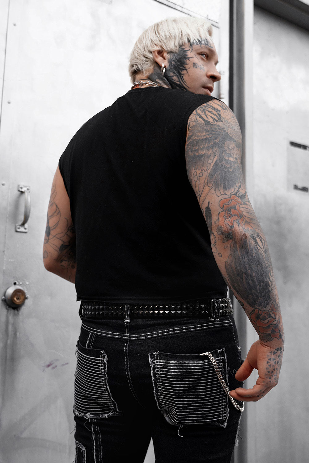 grunge goth authentic genuine real leather black pyramid studded punk belt worn by a man with tattoos named @onelowsoul