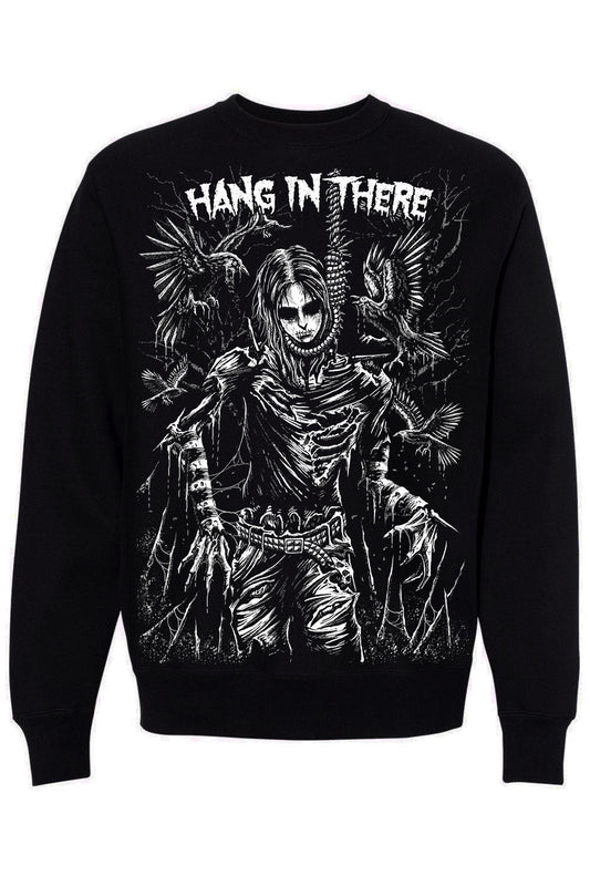 A black crewneck sweatshirt featuring a large white graphic print of a skeletal figure with wings and the text 'HANG IN THERE' across the chest, shown against a plain white background.