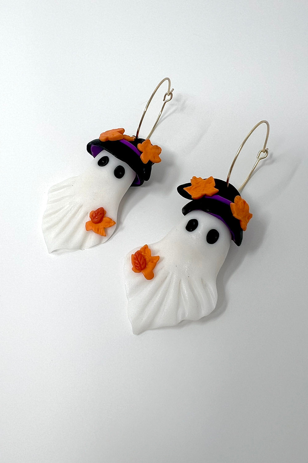 clay ghost earrings with gold hoops made of stainless steel