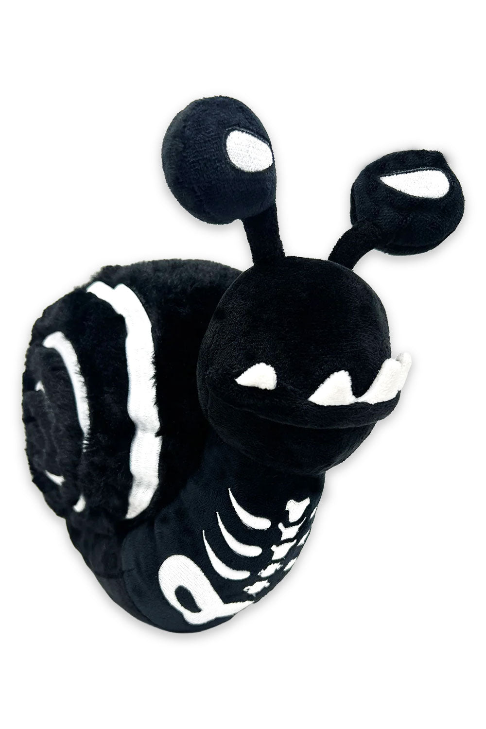Black and white plush toy resembling a snail on a white background