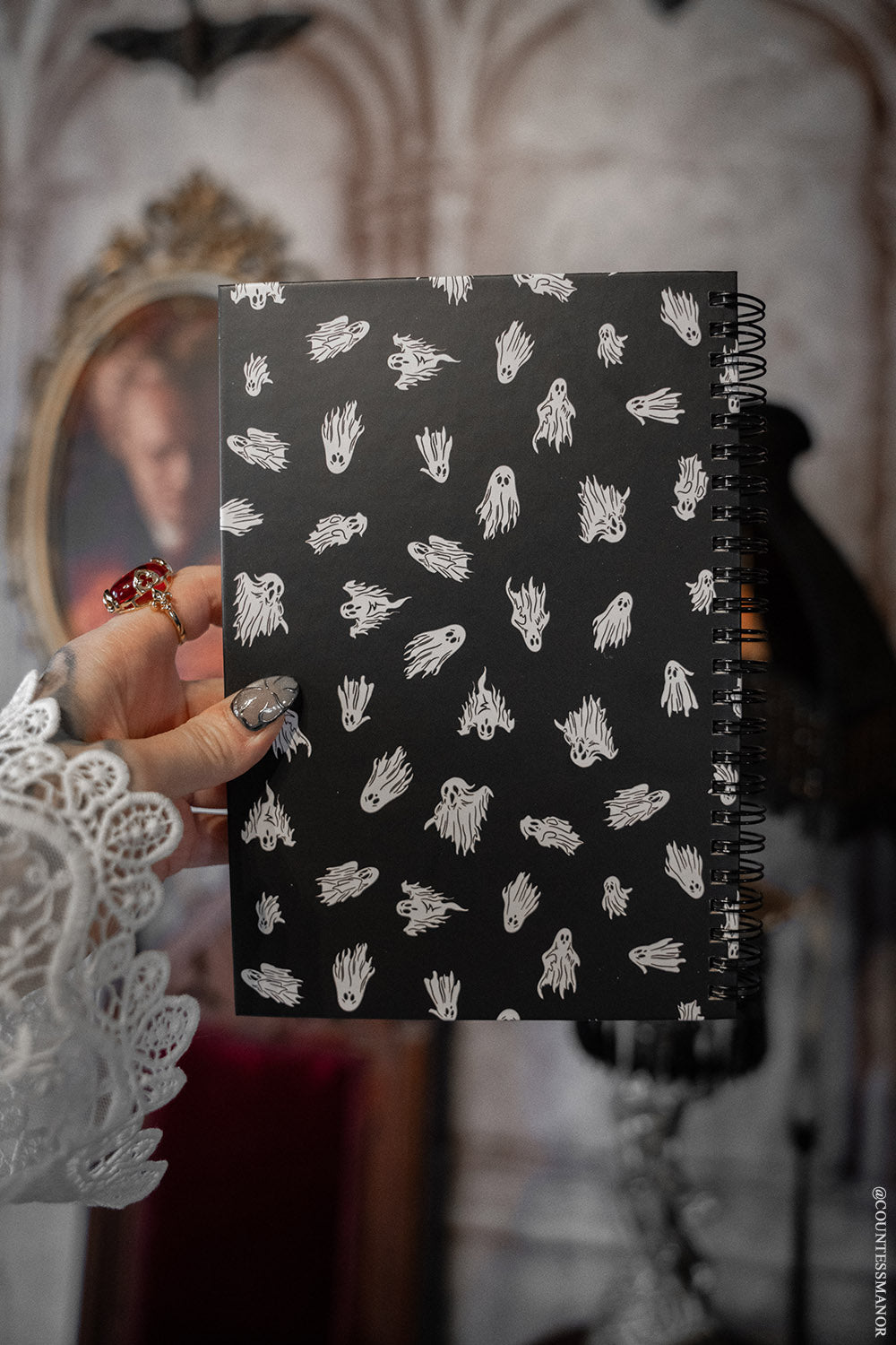 haunted mansion ghost notebook with lined pages and ghost artwork inside