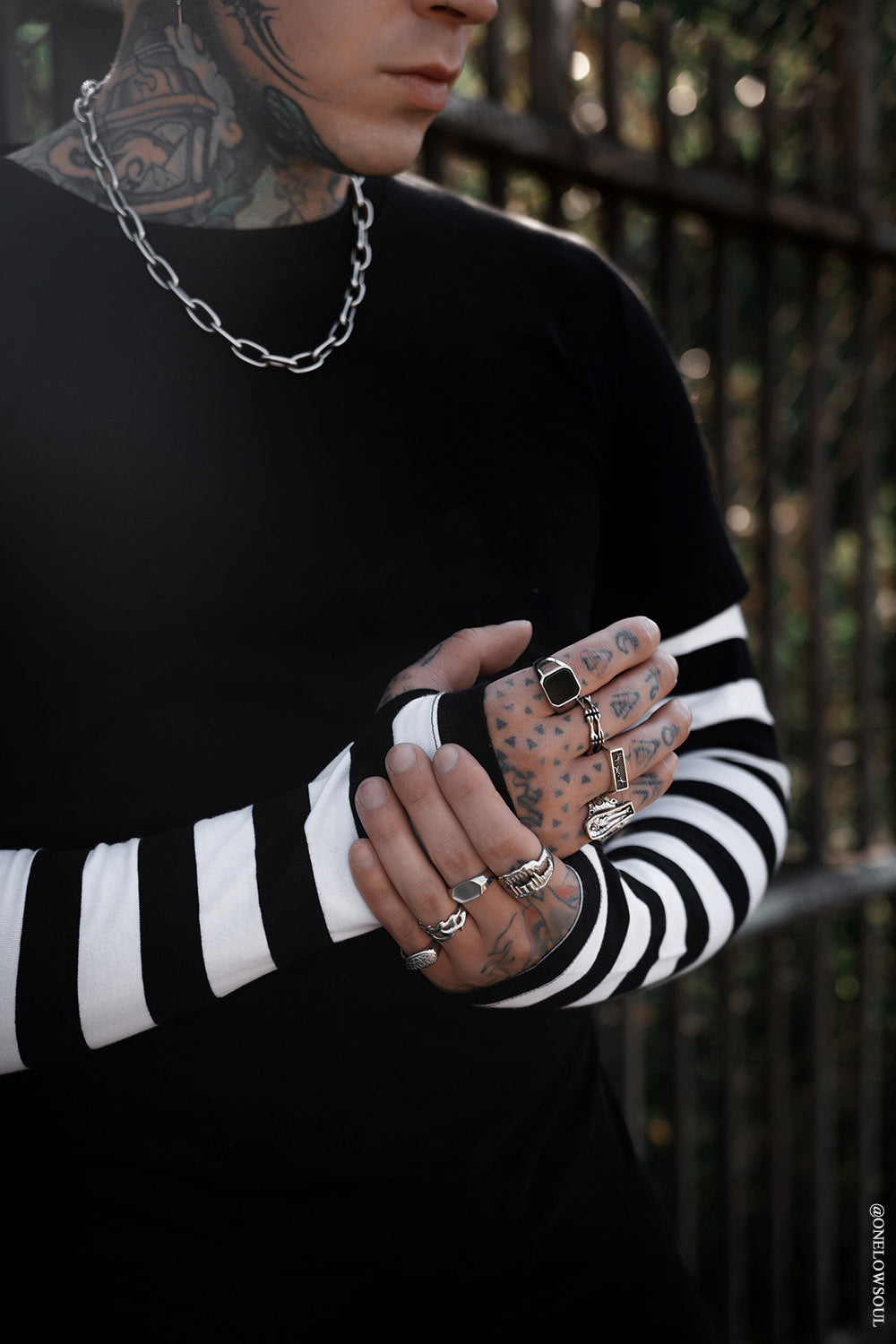 mens layered top with striped sleeves