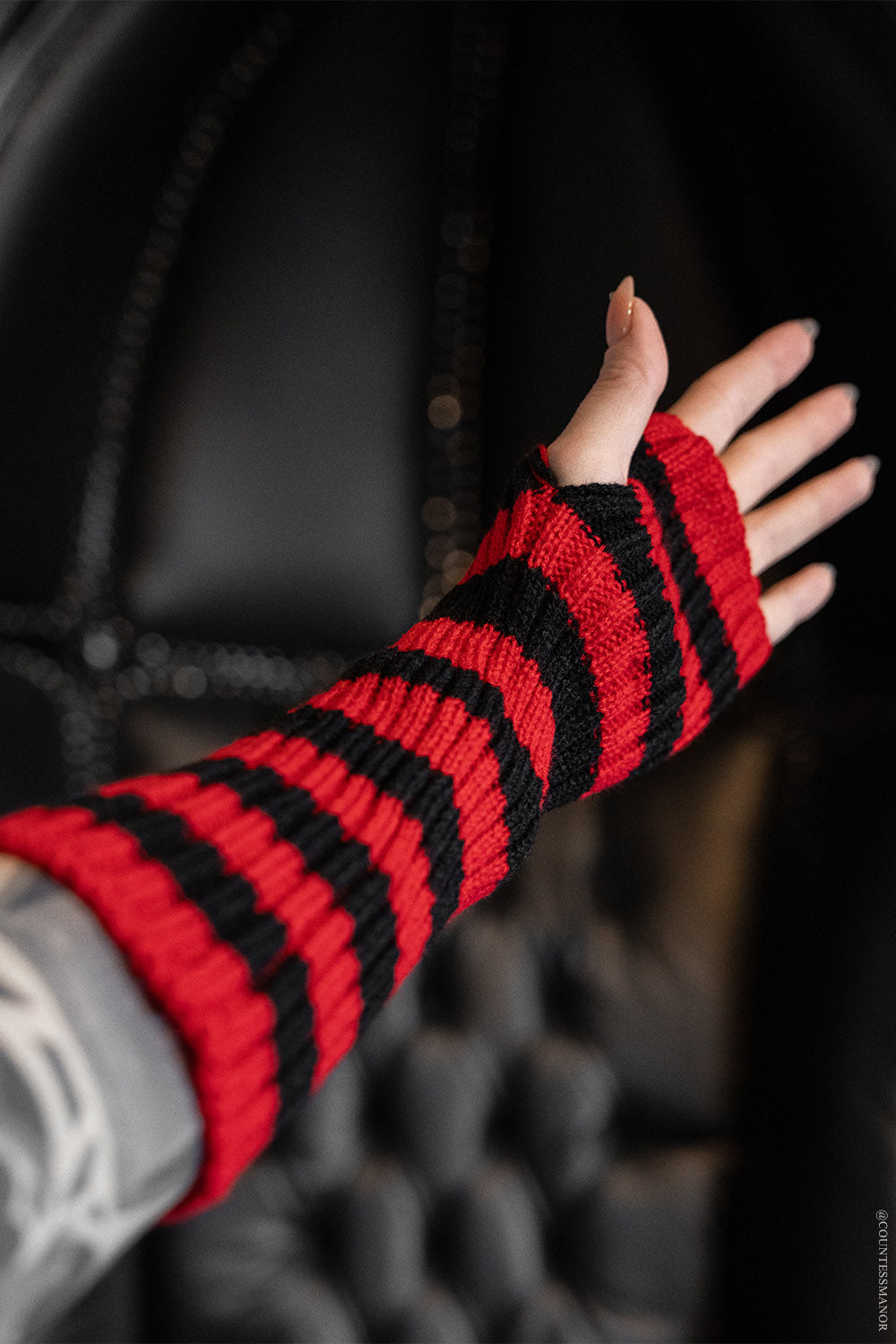 red and black striped gloves arm warmers