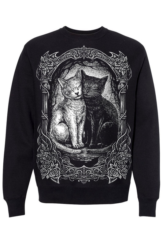 Black sweatshirt with a graphic of two cats in an ornate frame on a white background