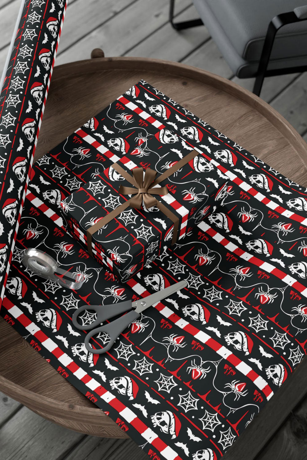 creepy skull, spider, goth santa hat, candy cane, bat, and web christmas wrapping paper for xmas