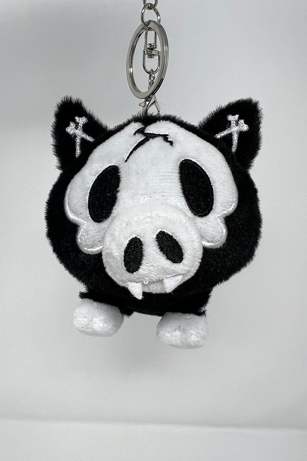 pig keychain with fangs