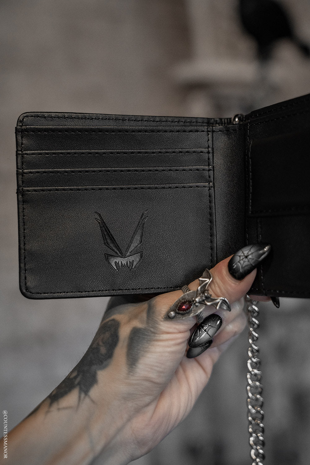 black punk mens wallet with vampire freaks branding 