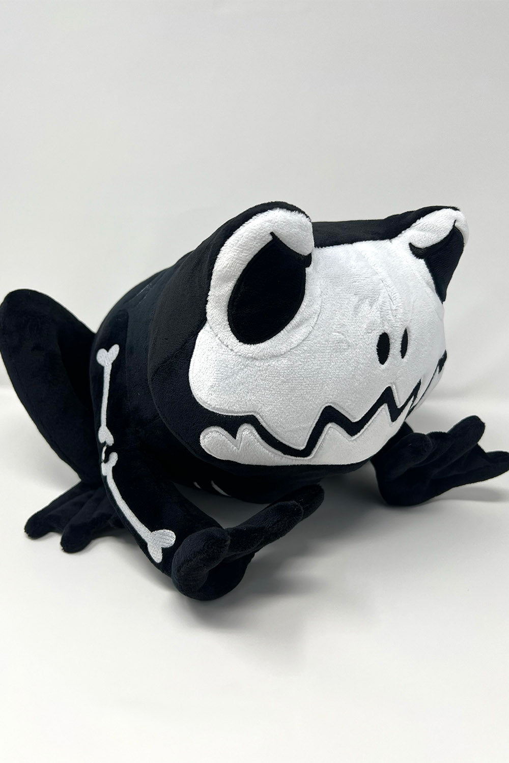 black and white skeleton toad plush toy
