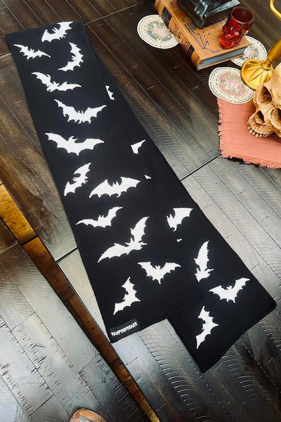 black scarf knitted with bats